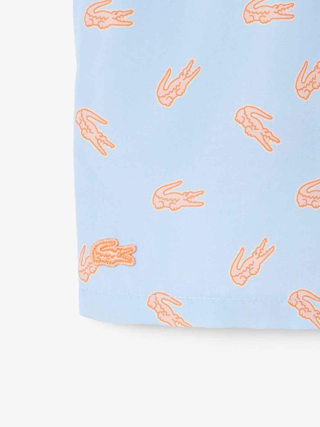 Lacoste costume kids celeste con logo arancio