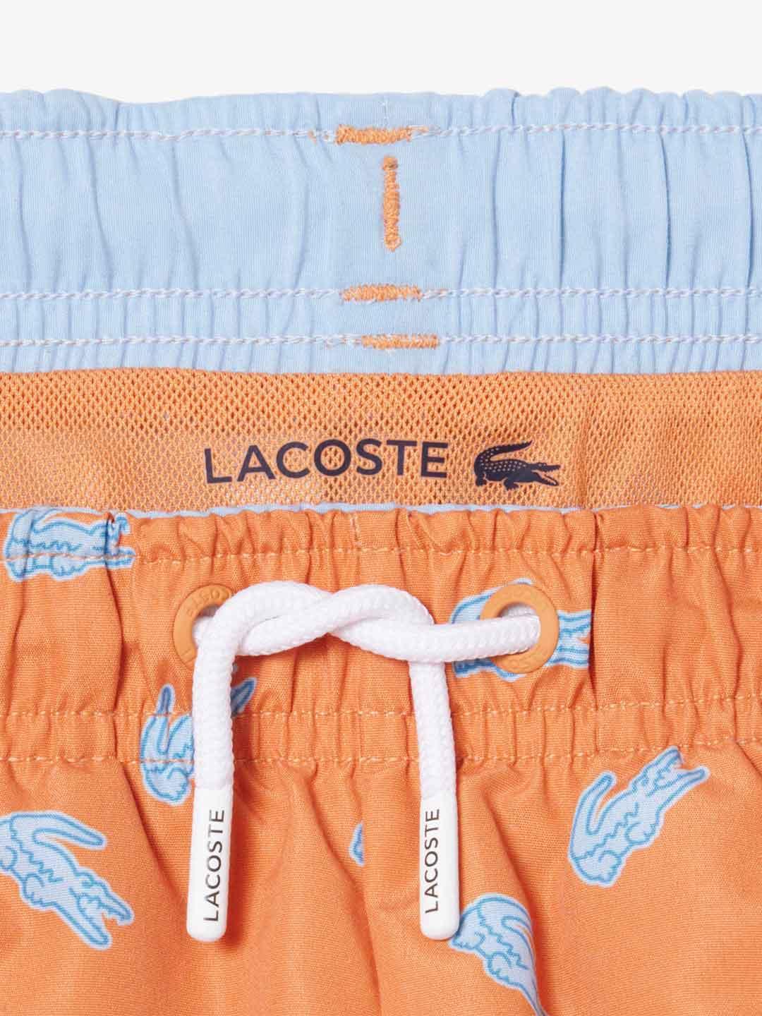 Lacoste costume kids arancio con logo celeste