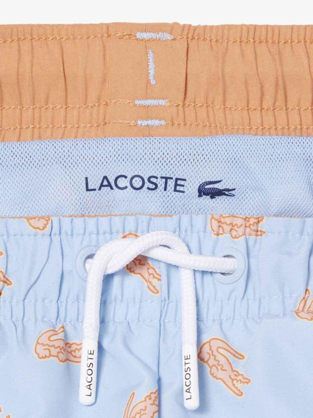 Lacoste costume kids celeste con logo arancio