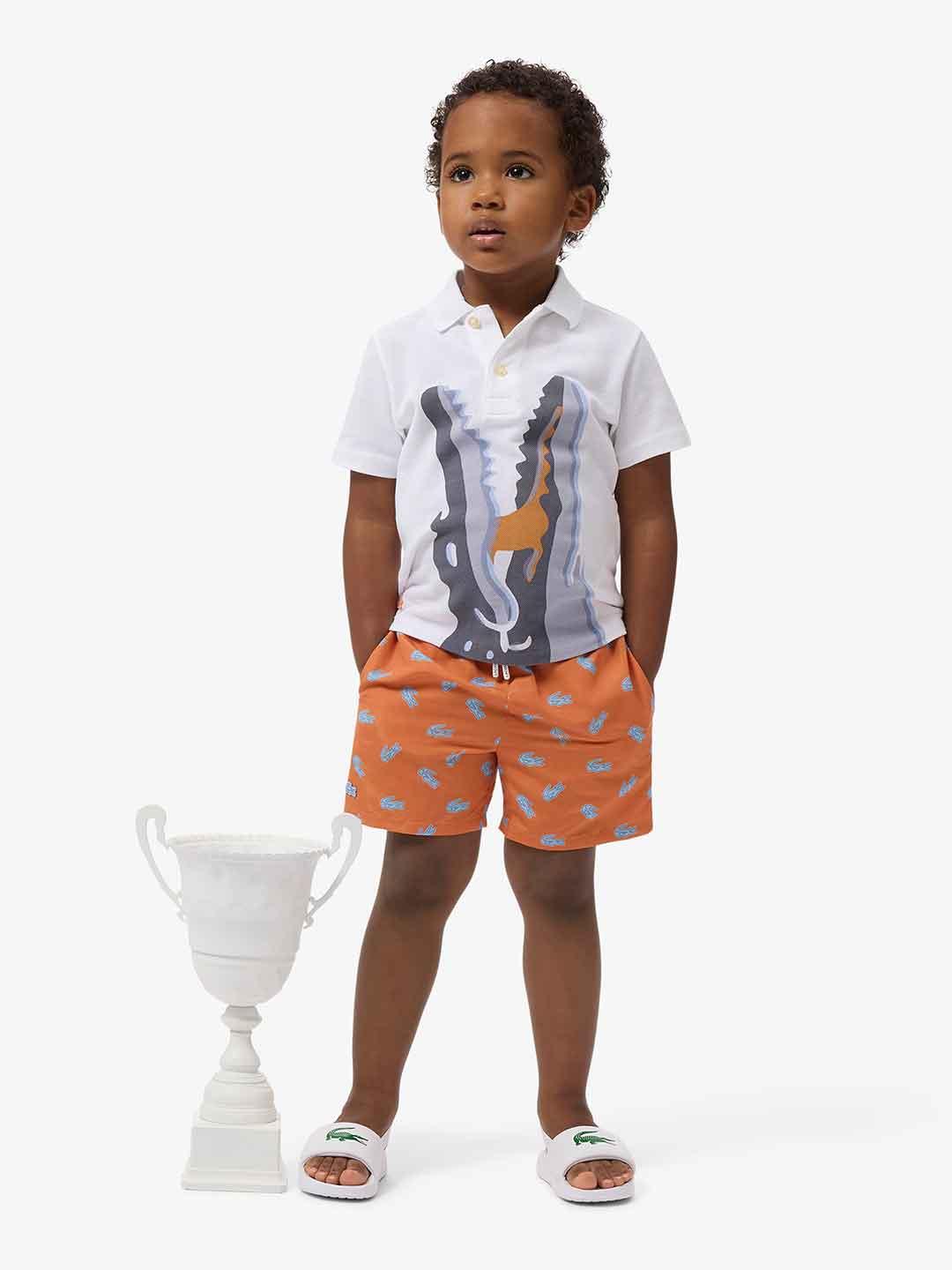 Lacoste costume kids arancio con logo celeste