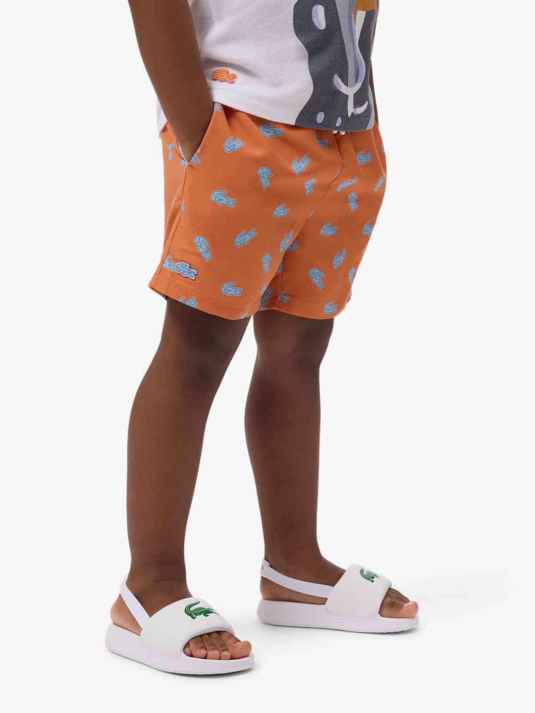 Lacoste costume kids arancio con logo celeste