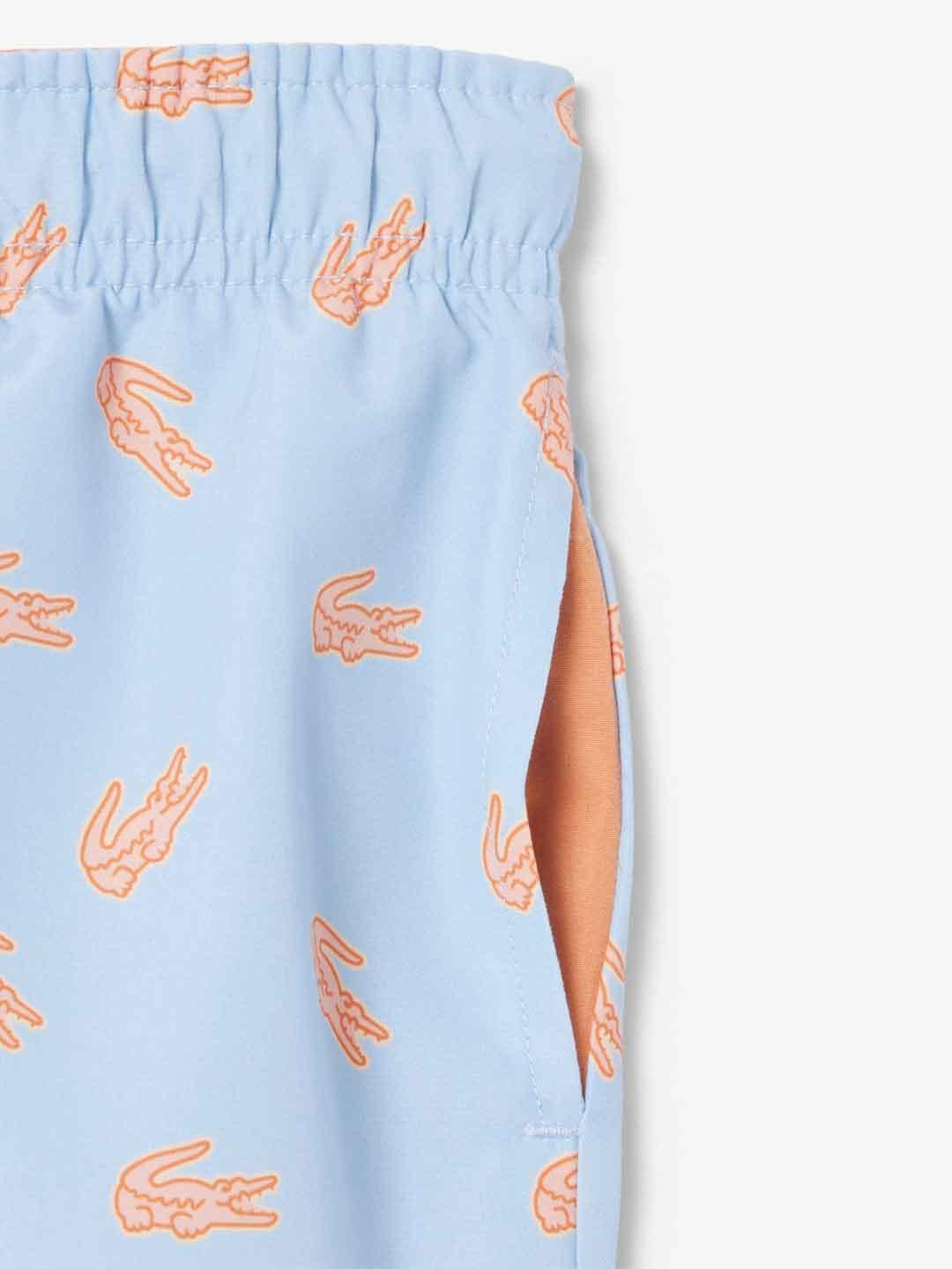 Lacoste costume kids celeste con logo arancio