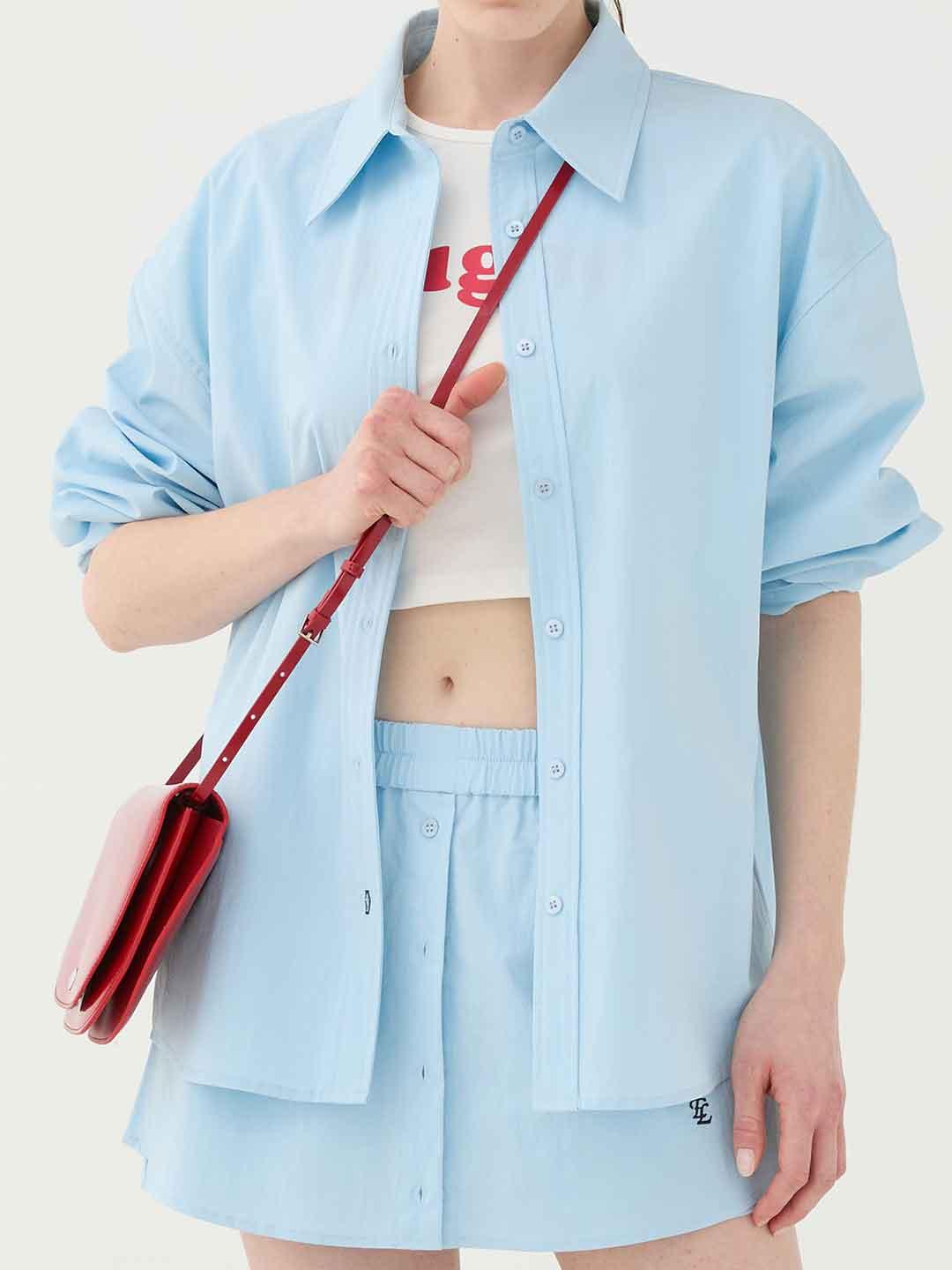 Eleh camicia celeste con ricamo sul retro