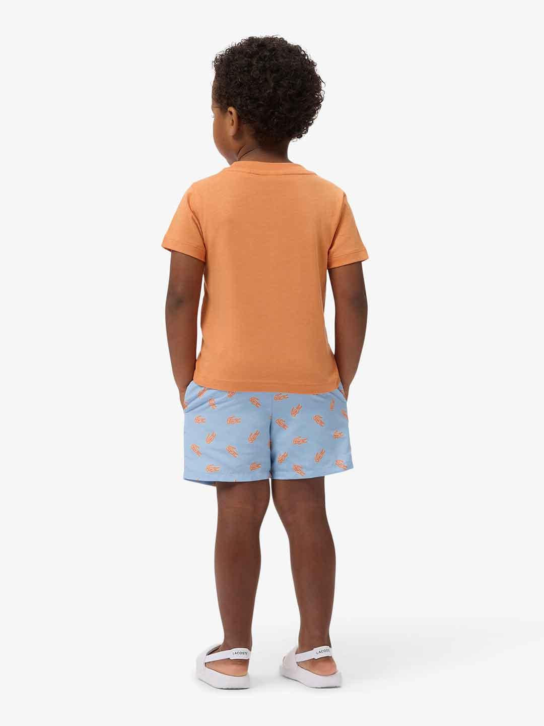 Lacoste costume kids celeste con logo arancio